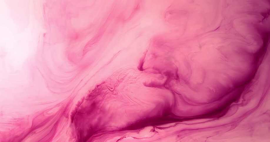 A cloudy pink and magenta substance moves and expands as it blends and covers the white area