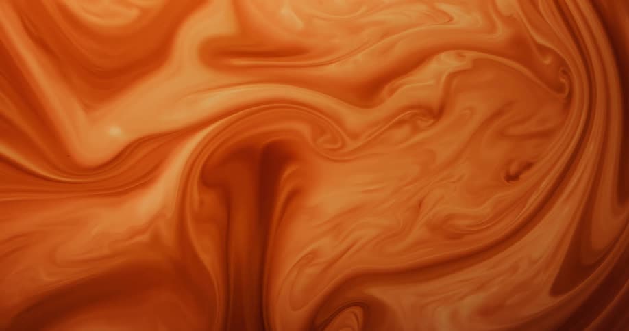 A light orange liquid flows and swirls around in this abstract scene