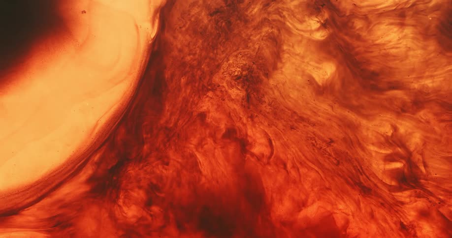 Smooth glowing mass abuts darker more striated section