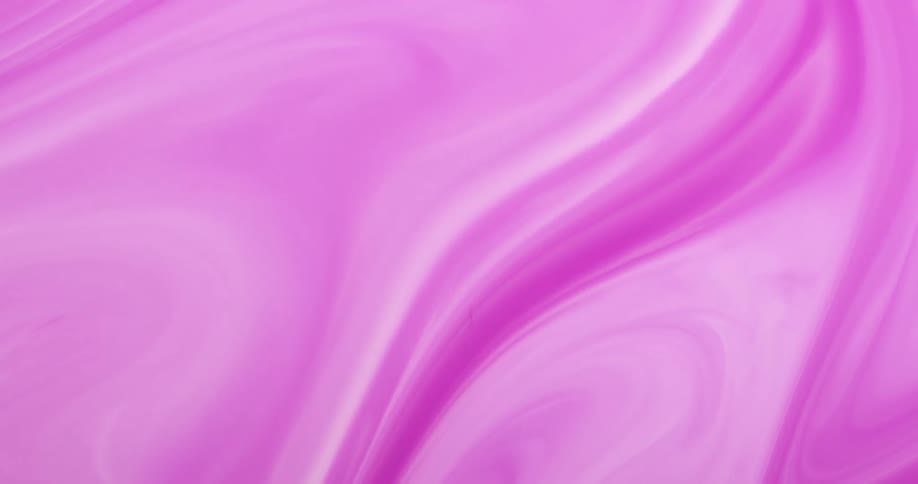 Abstract pink and white paint swirling around and looking psychedelic