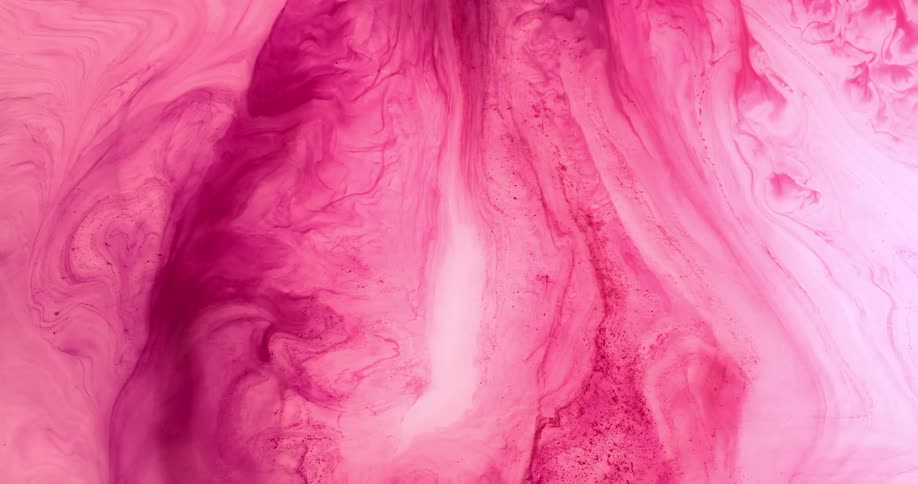 Pink liquid is being mixed together
