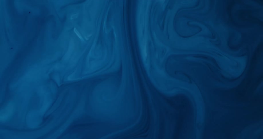 Shades of a blue liquid substance splash into the mix and blend as it swirls and moves