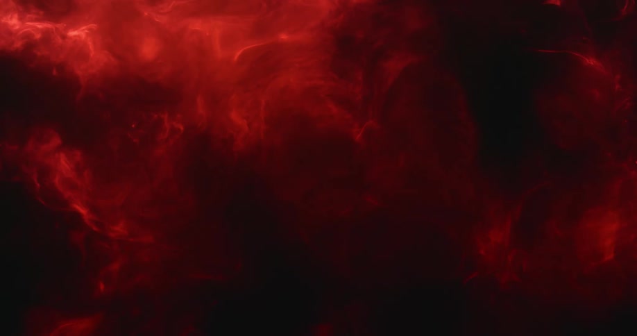 A cloudy red fluid swirls and mixes very slowly in a surreal manner