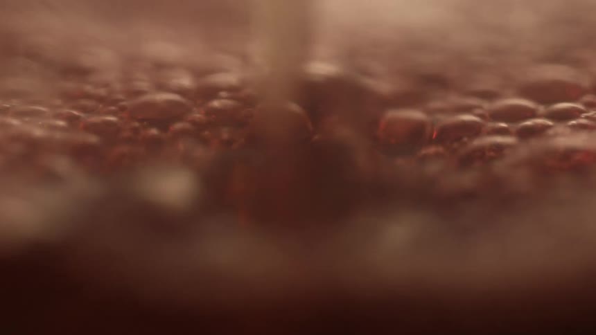 Liquid being poured and bubbling up