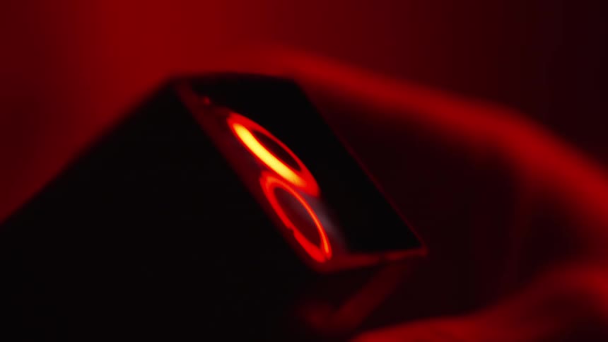 Close-up of analog viewer equipment in red light, analog photography, darkroom mood
