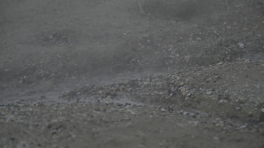 Water in a stream spraying in the wind