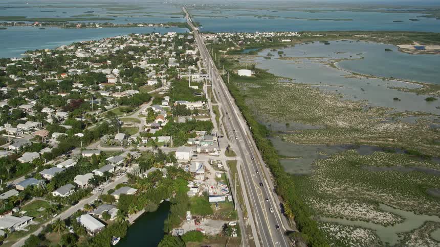 Aerial footage of flying over Overseas Highway revealing Big Coppitt Key Floridas coastal community