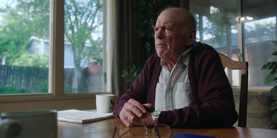 A man is talking at the table