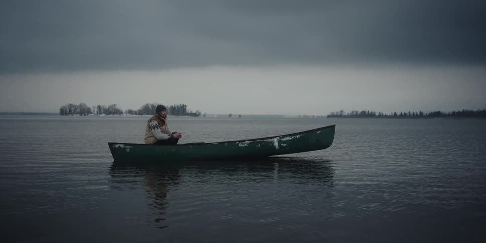 A man is sitting in his boat