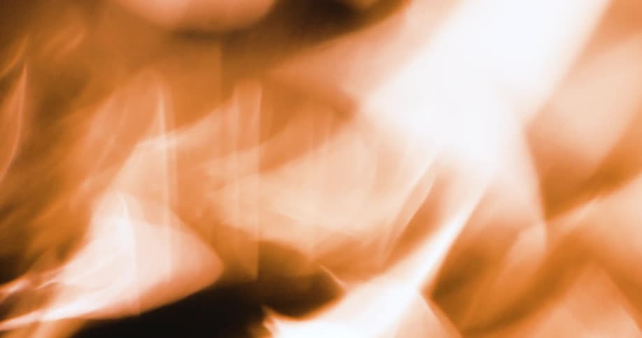 Close up distorted footage of yellow lights flaring reflections