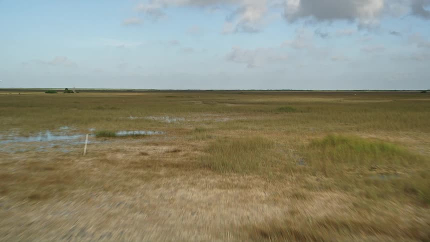 Flying low over the wetlands of Florida this aerial footage offers a breathtaking view of the beautiful Florida Everglades