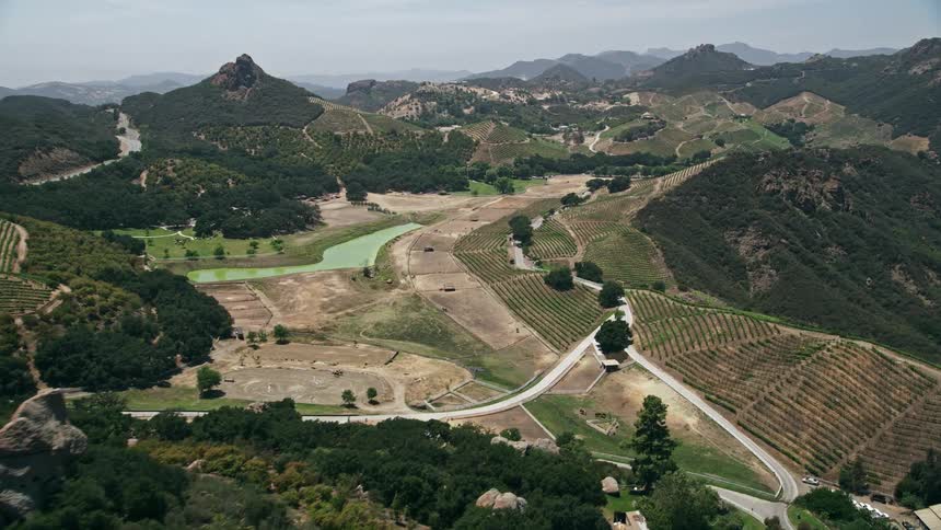 An aerial flyby captures the beauty of Malibus rocky hilltops vineyards and country roads providing a scenic tour of Southern Californias wine country