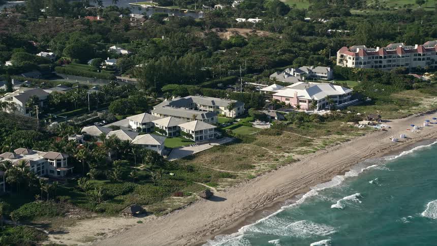 Passing by luxury waterfront condominiums on the beachfront of Delray Beach in Florida during summertime