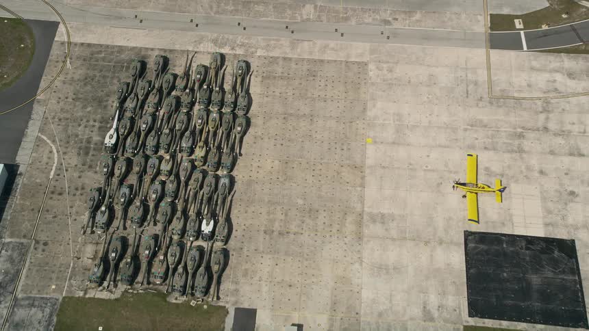 Aerial footage of helicopter bodies stored at Melbourne Regional Airport Florida