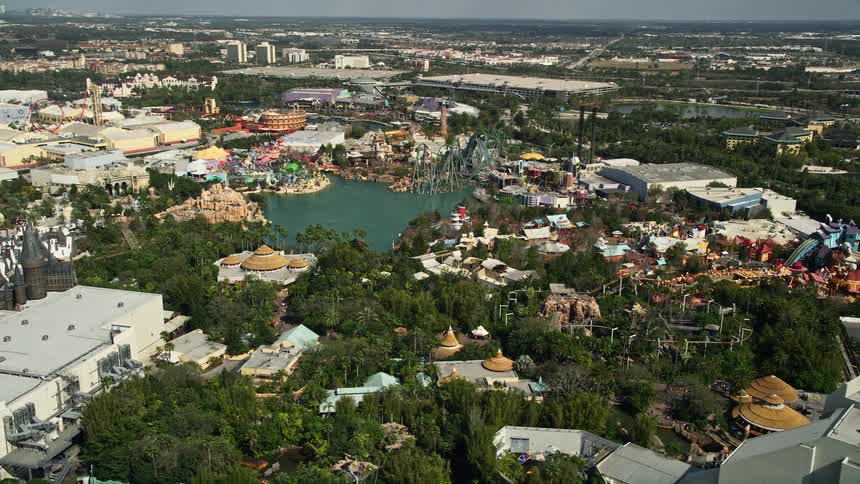 An aerial view of Universal Studios Florida theme park in Orlando Florida on a partly cloudy day providing viewers with a sightseeing and recreation opportunity