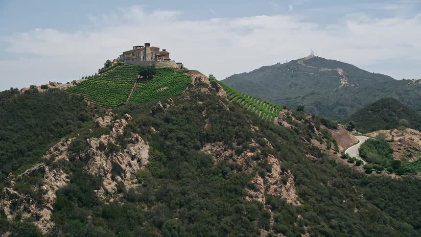 Approaching the rustic and scenic Rocky Oaks Estate Vineyards in Malibu CA via aerial footage