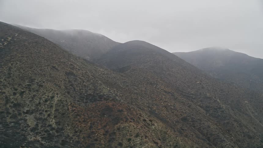 Aerial footage of the foggy Santa Monica Mountains in California showcasing the natural and hazy beauty of the mountain landscape