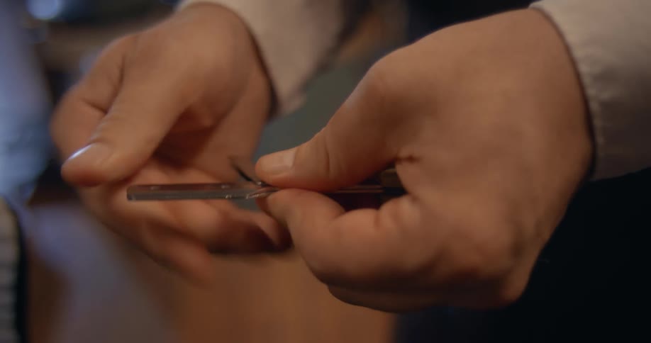 A barber closes his razor
