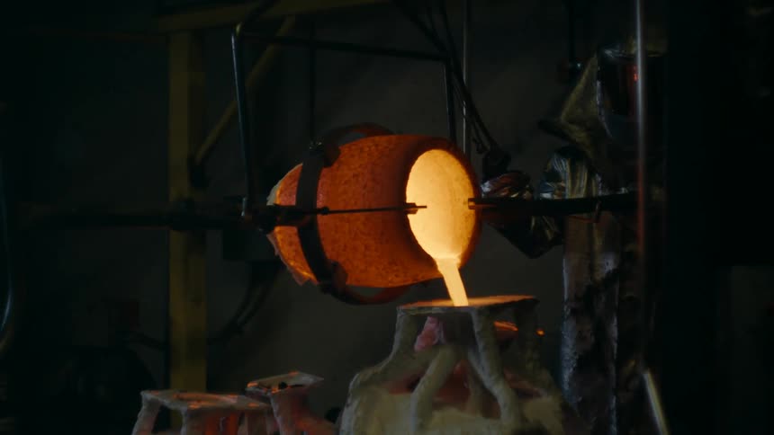 A mining center where a jar is pouring out a fiery liquid into a molded plant on the floor