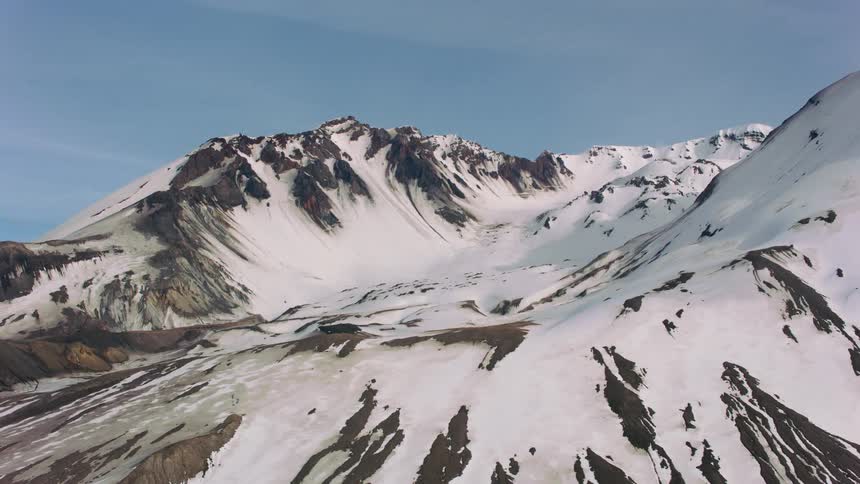 Thick snow covers peaks on a mountain range