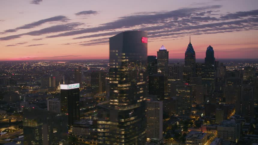 Aerial view of the tall buildings on the city skyline at evening
