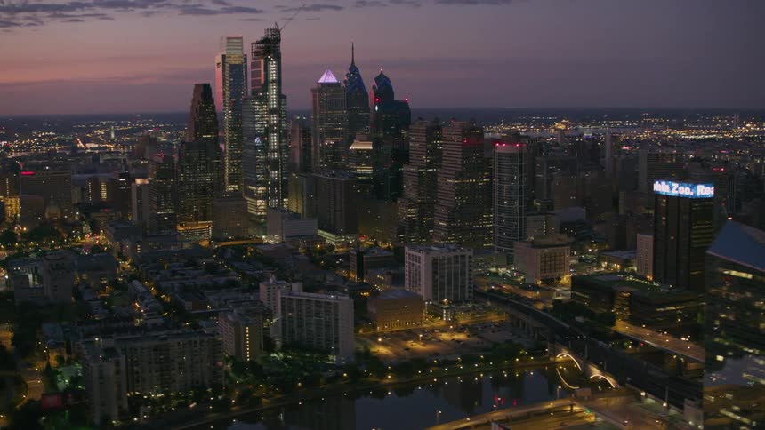 An aerial view of the tower block in a downtown metropolis at sunset