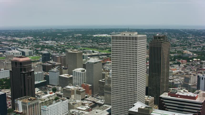 Highway cuts through city on the edge of downtown skyscrapers