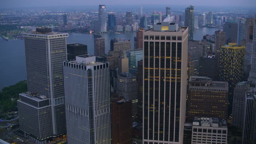 A striking cityscape characterized by modern tall buildings situated near the water