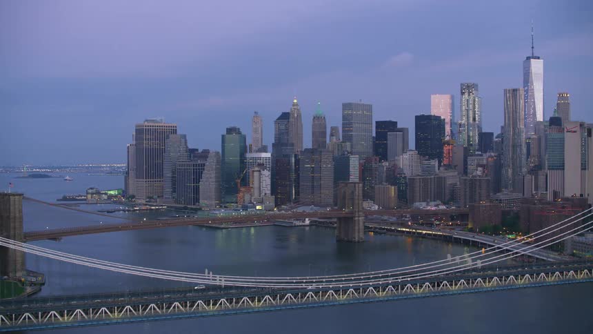 Aerial view of the bridges in front of the new york city skyline