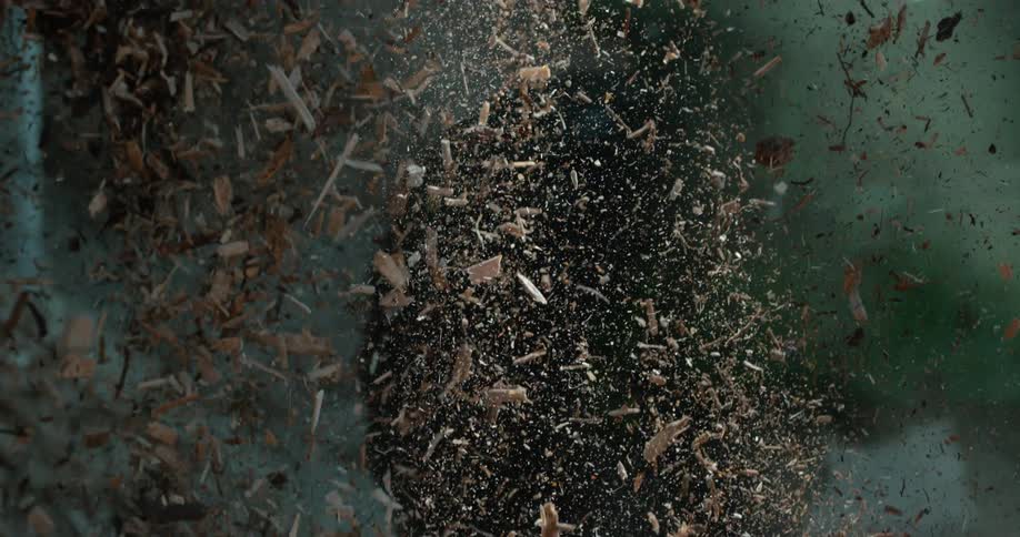 Close up of wooden chips falling