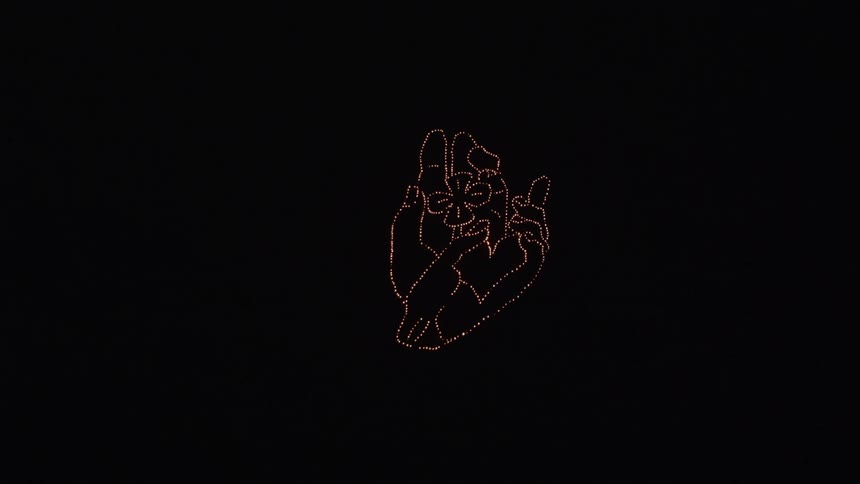 An art piece is made up of shimmering lights forming a design