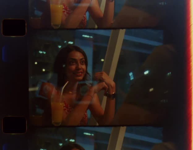 A womans jaw drops while speaking with a man in a bar