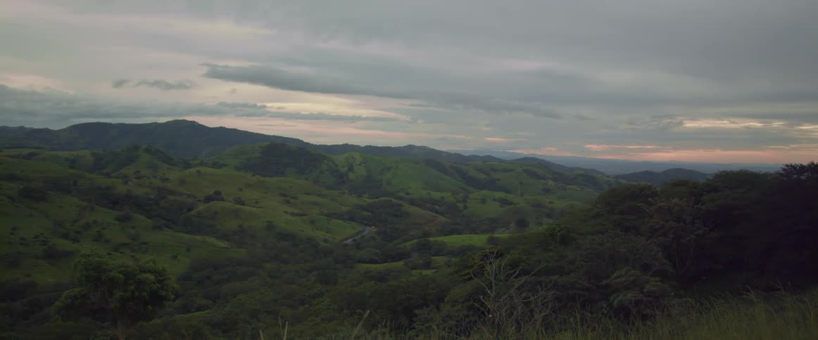 A mountain range is covered with grass