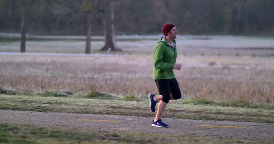 A man is running on a trail