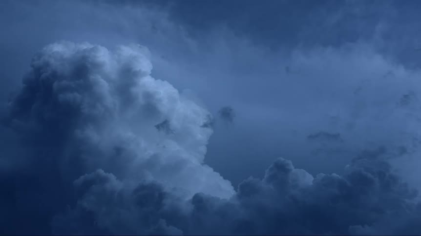 Lighting strikes through dark clouds in the sky