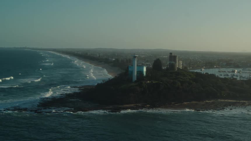 A peninsula with a modern lighthouse