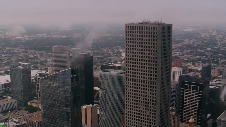 A skyscraper reaching the clouds in a city center