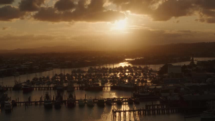 An aerial view of boats docked at a pier