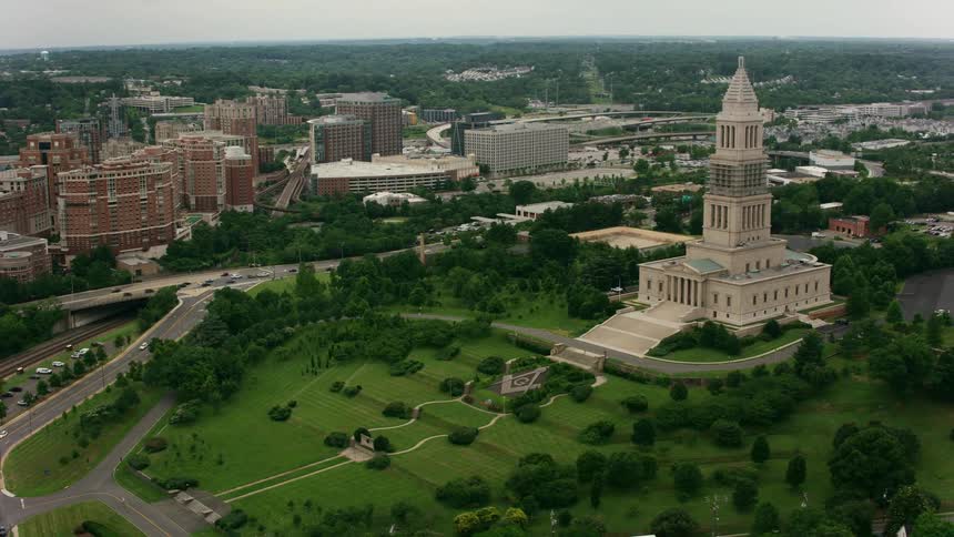 Tall and wide steps lead up to a historic building in a city