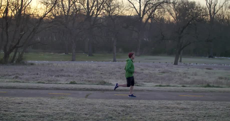 A man jogs down the road