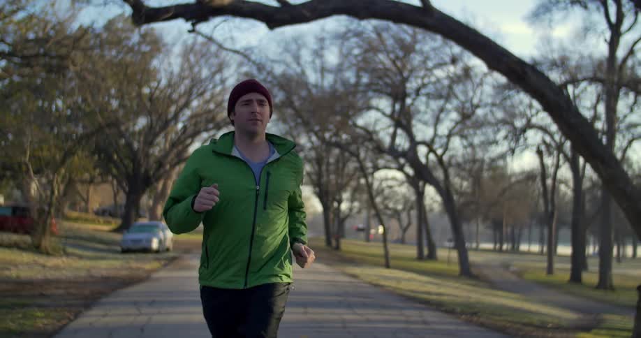 A man jogs down a road