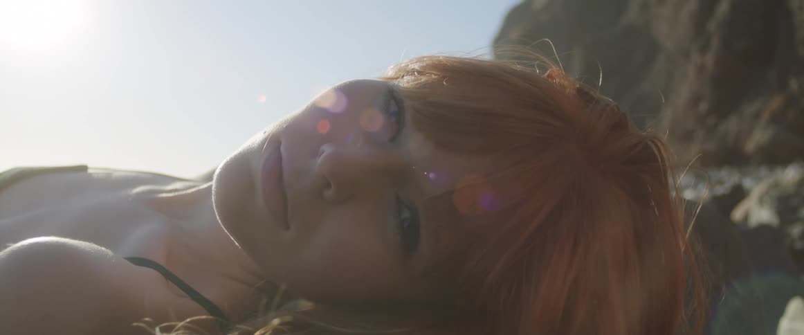 A young woman lying on the beach
