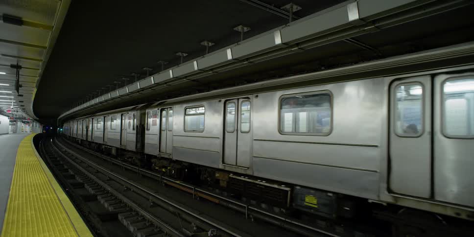 A train goes through an empty station