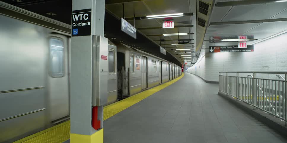 A train takes off from a subway station