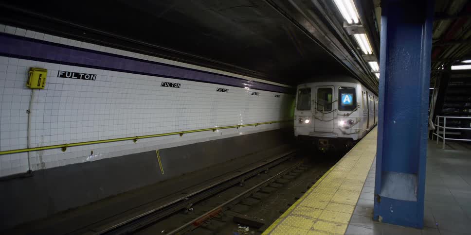 Subway train enters fulton street station new york city
