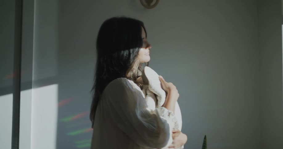 A mother holding her baby