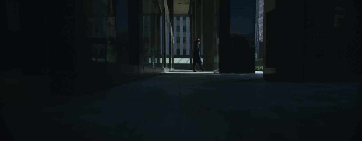 A person walks form the building