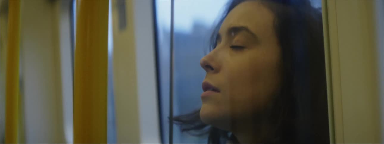 Sad woman travels by train
