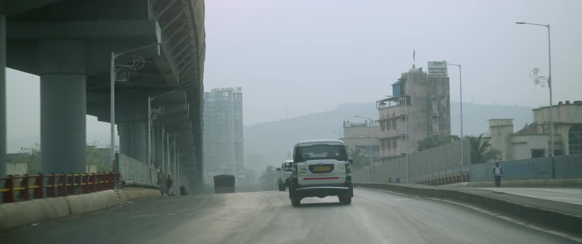 Vehicle drives along city highway
