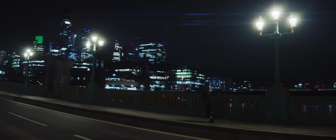 A person is running in the street during night time